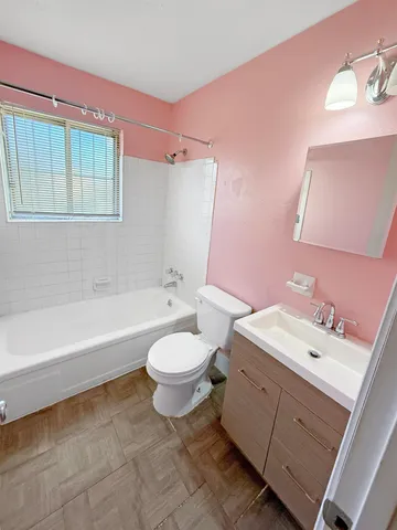 a bathroom with a sink a toilet and bathtub