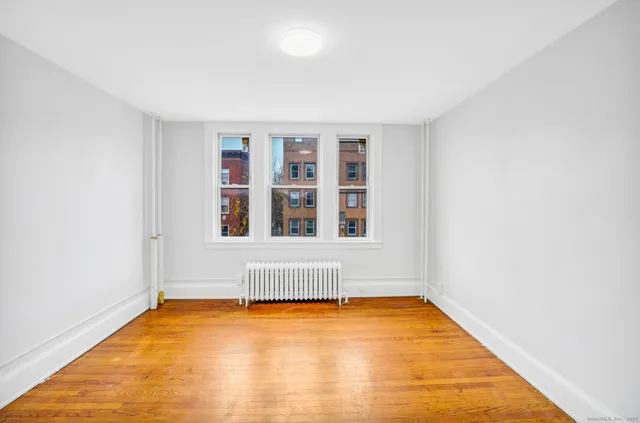 an empty room with a chandeliers