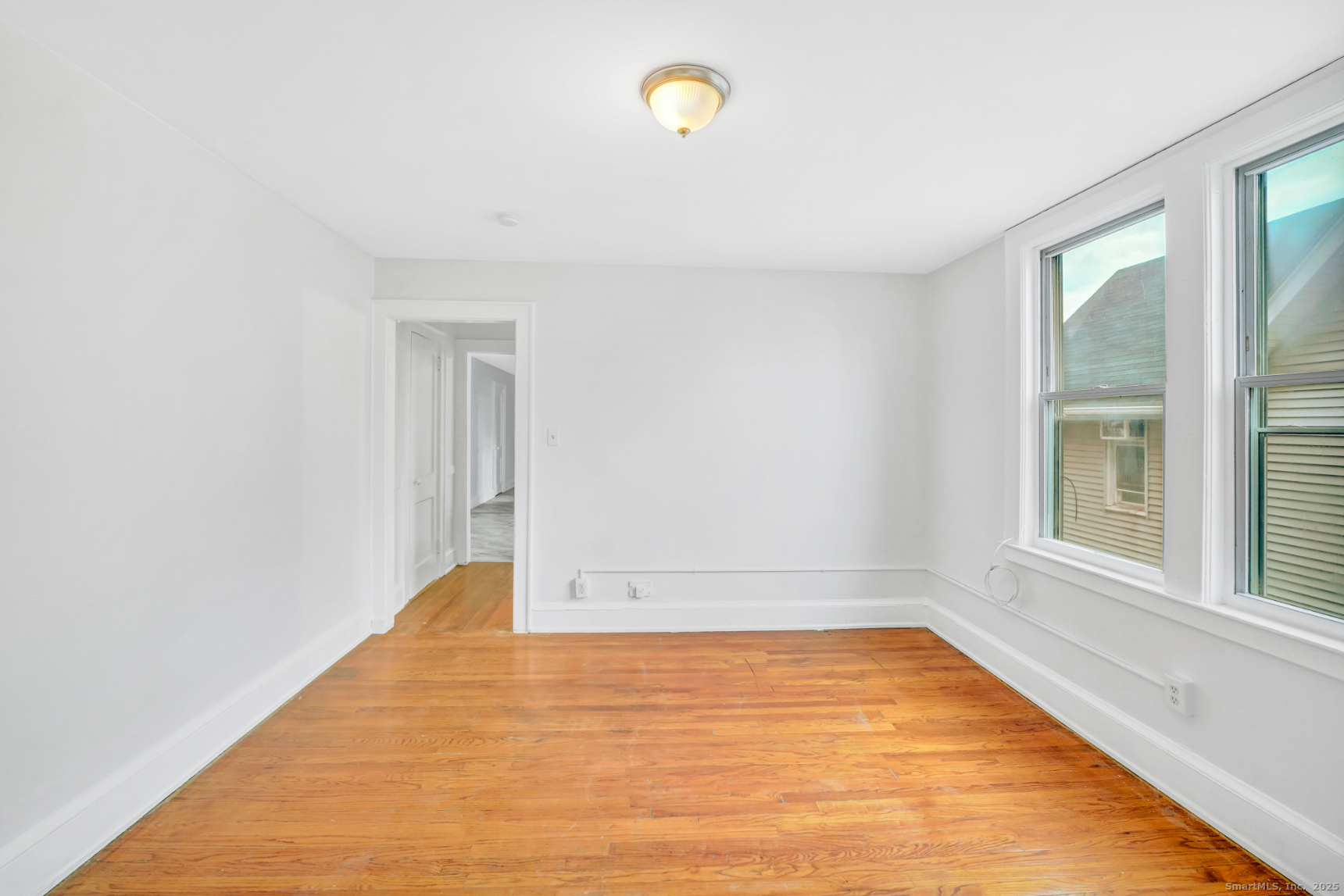 1040 Capitol Avenue, Unit 2E Hartford, CT 06106 - Photo 3 of 5 a view of empty room with window and floor to ceiling window