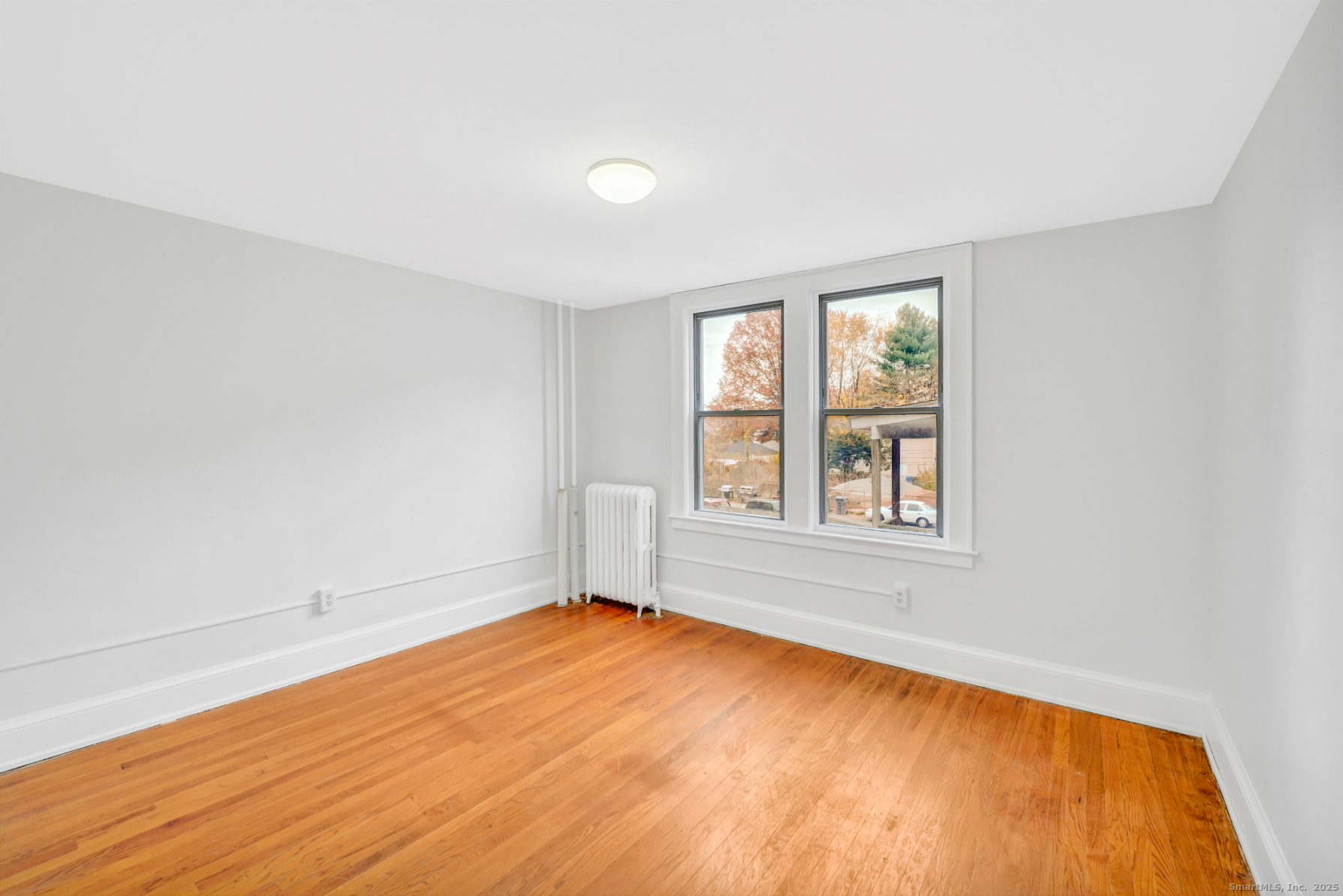 1040 Capitol Avenue, Unit 2E Hartford, CT 06106 - Photo 4 of 5 an empty room with a window