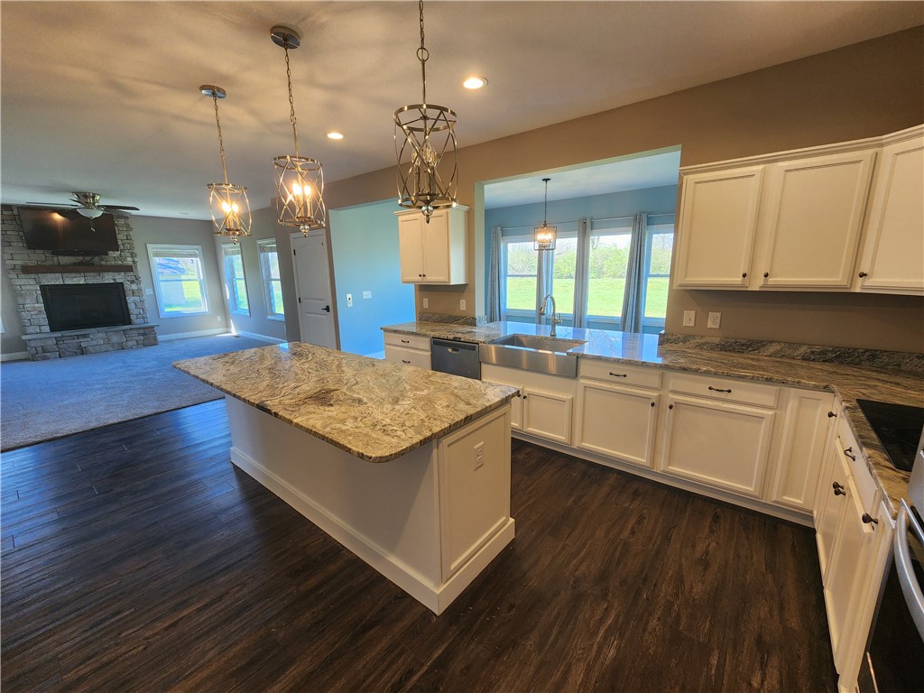 7441 Dodson Road Brookville, OH 45309 - Photo 50 of 50 This kitchen features a beautiful island, rich hardwood flooring, and abundant cabinet space.