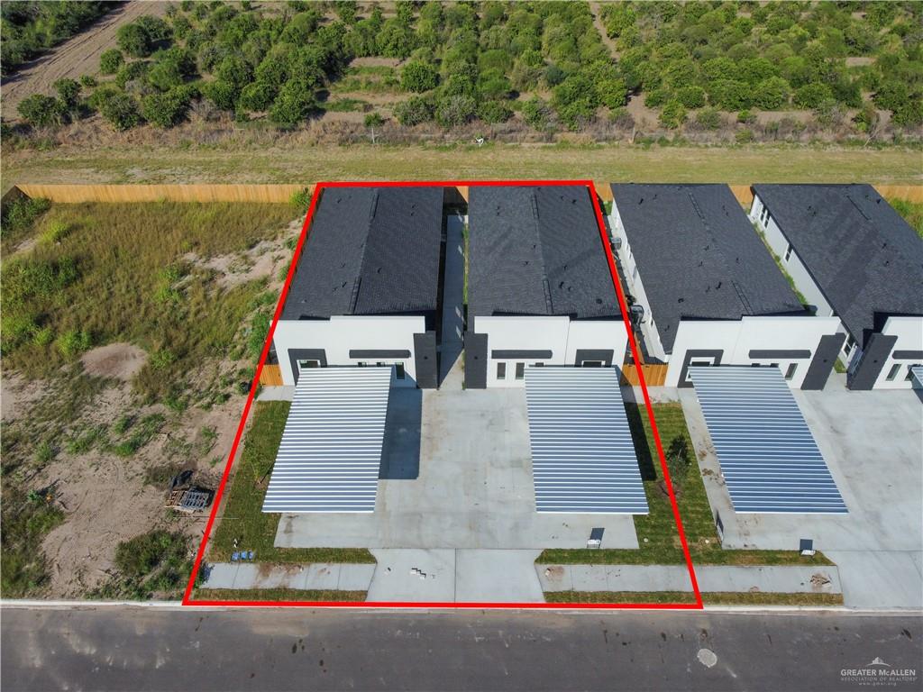 909 East 13th Street, Unit 4 San Juan, TX 78589 - Photo 14 of 14 an aerial view of residential houses with outdoor space