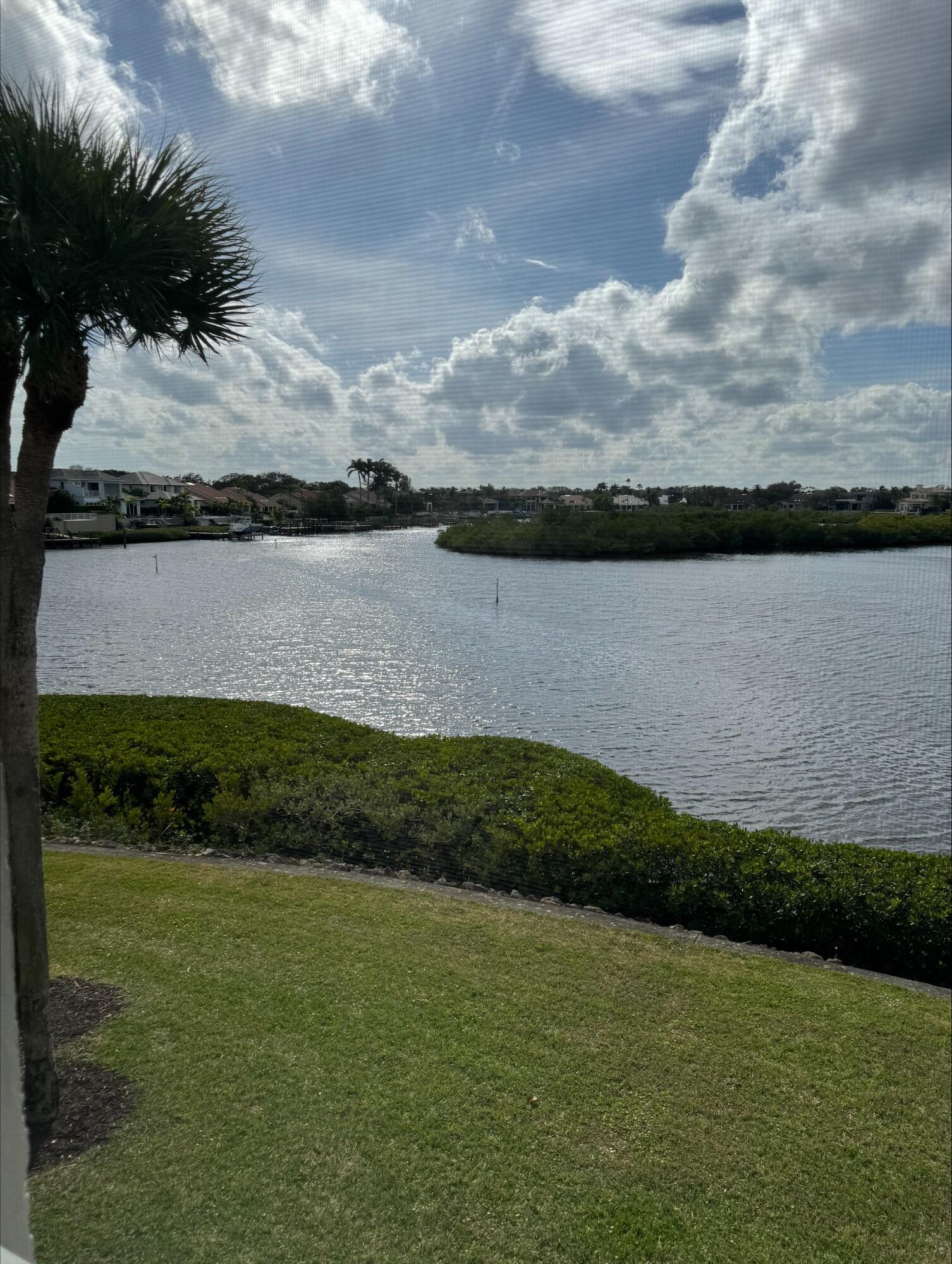 2703 Captains Way Jupiter, FL 33477 - Photo 11 of 57 a view of a lake in middle of the house