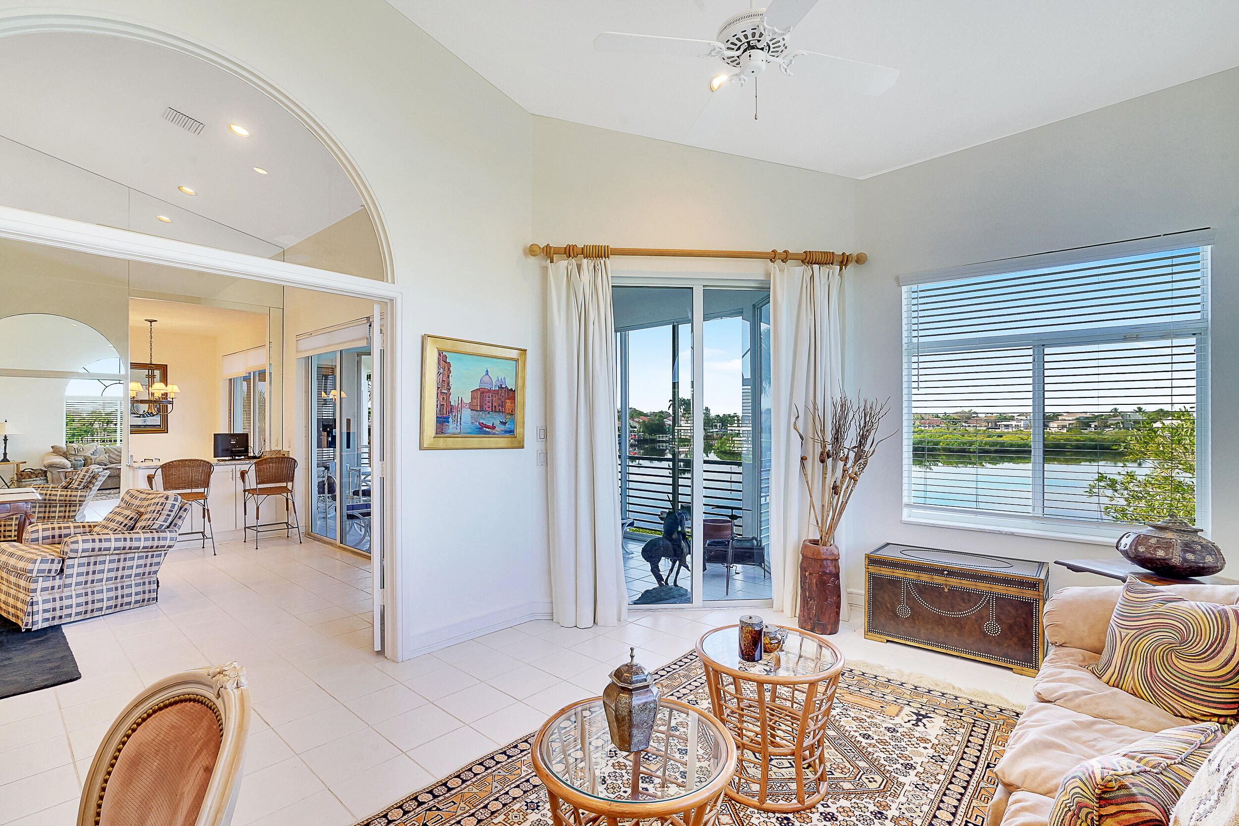 2703 Captains Way Jupiter, FL 33477 - Photo 12 of 57 a living room with furniture and a floor to ceiling window
