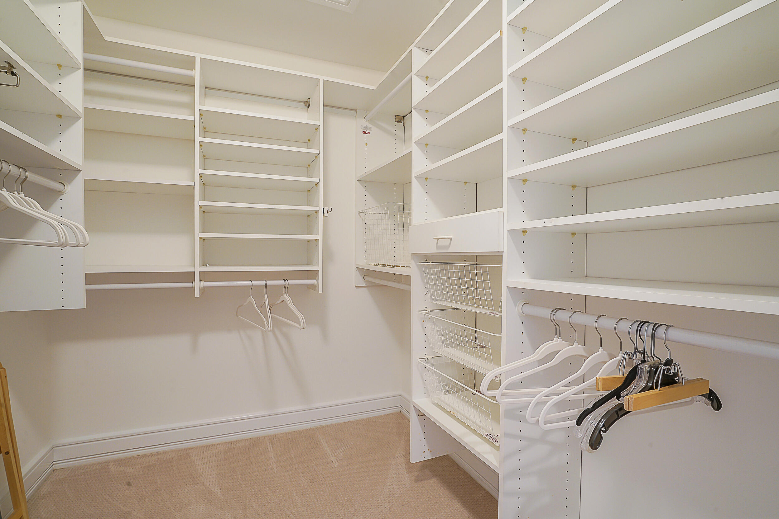 2703 Captains Way Jupiter, FL 33477 - Photo 20 of 57 a view of walk in closet with empty racks