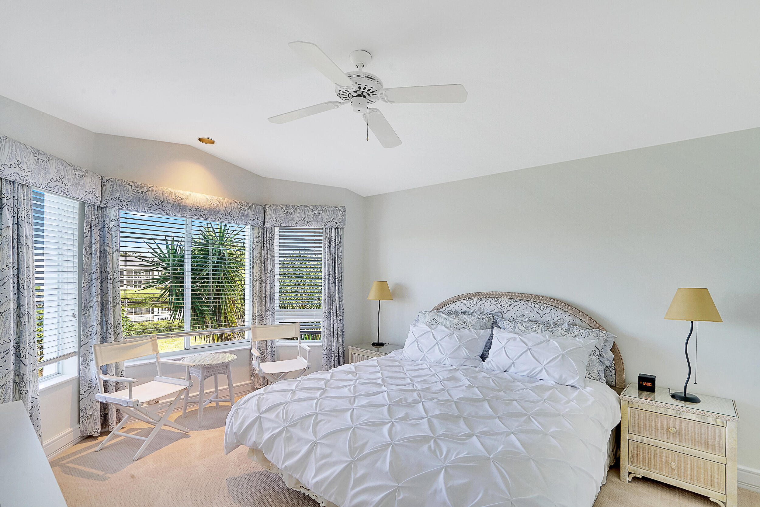 2703 Captains Way Jupiter, FL 33477 - Photo 23 of 57 a bedroom with a bed and window
