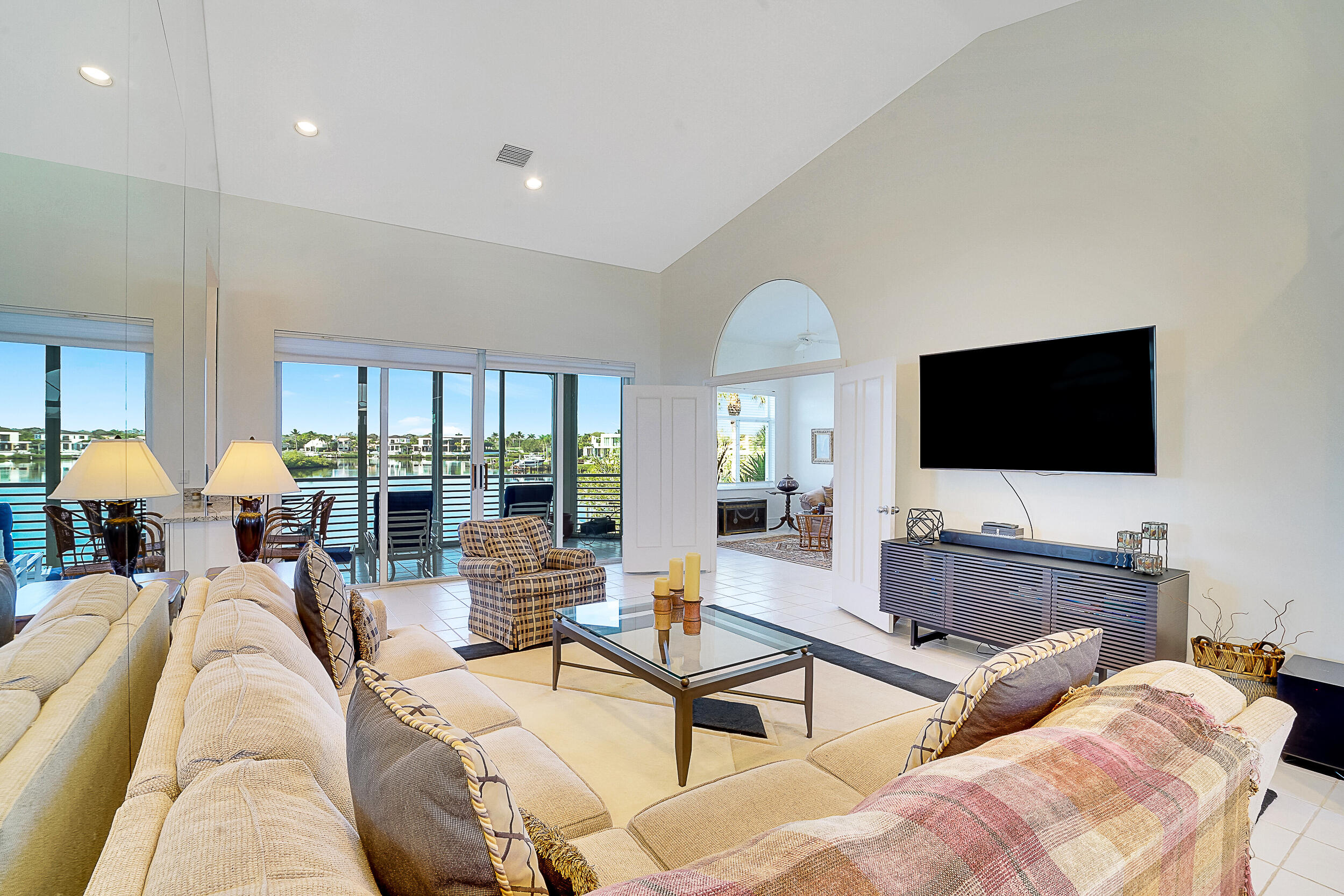 2703 Captains Way Jupiter, FL 33477 - Photo 4 of 57 a living room with furniture and a flat screen tv