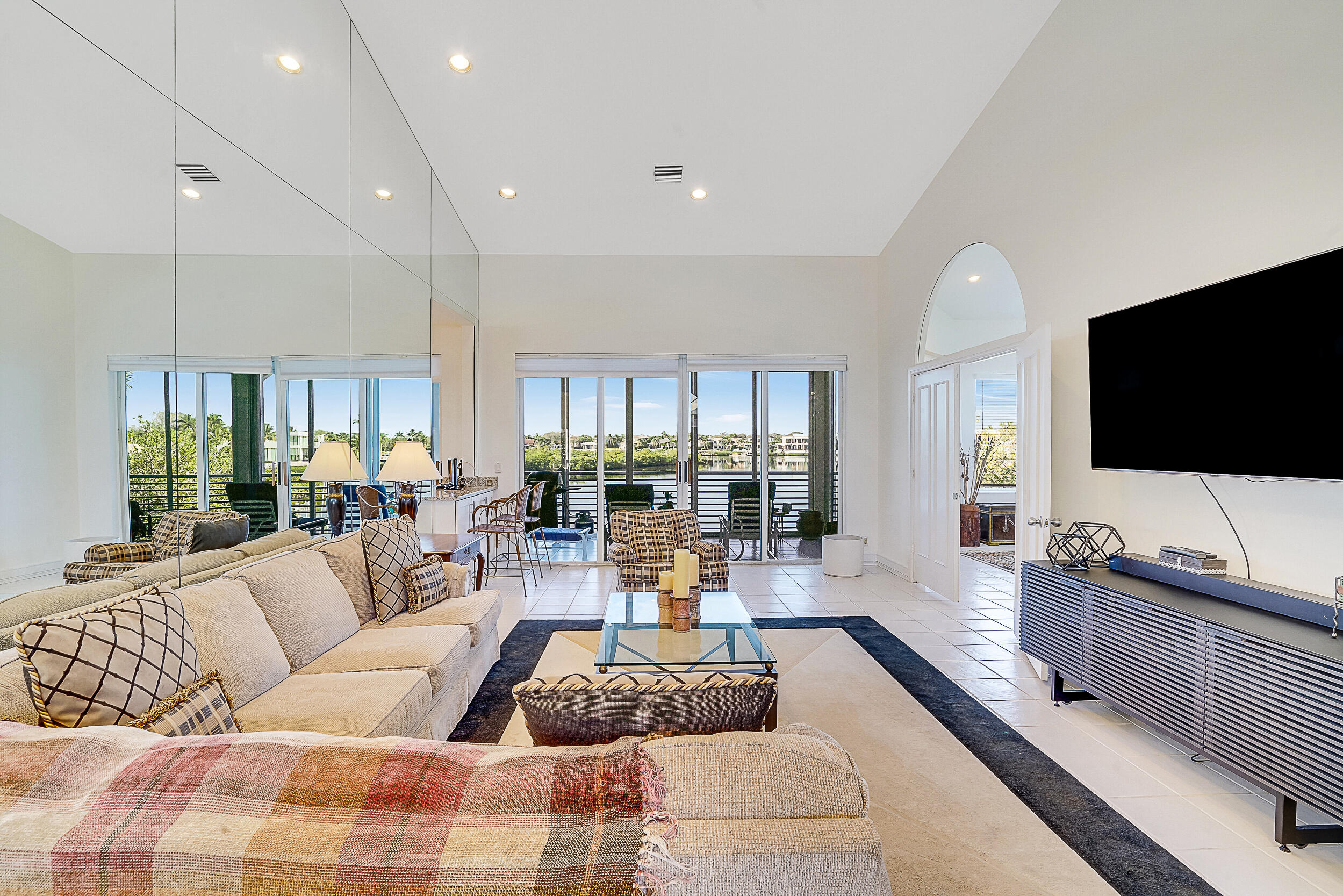 2703 Captains Way Jupiter, FL 33477 - Photo 5 of 57 a living room with furniture and a flat screen tv