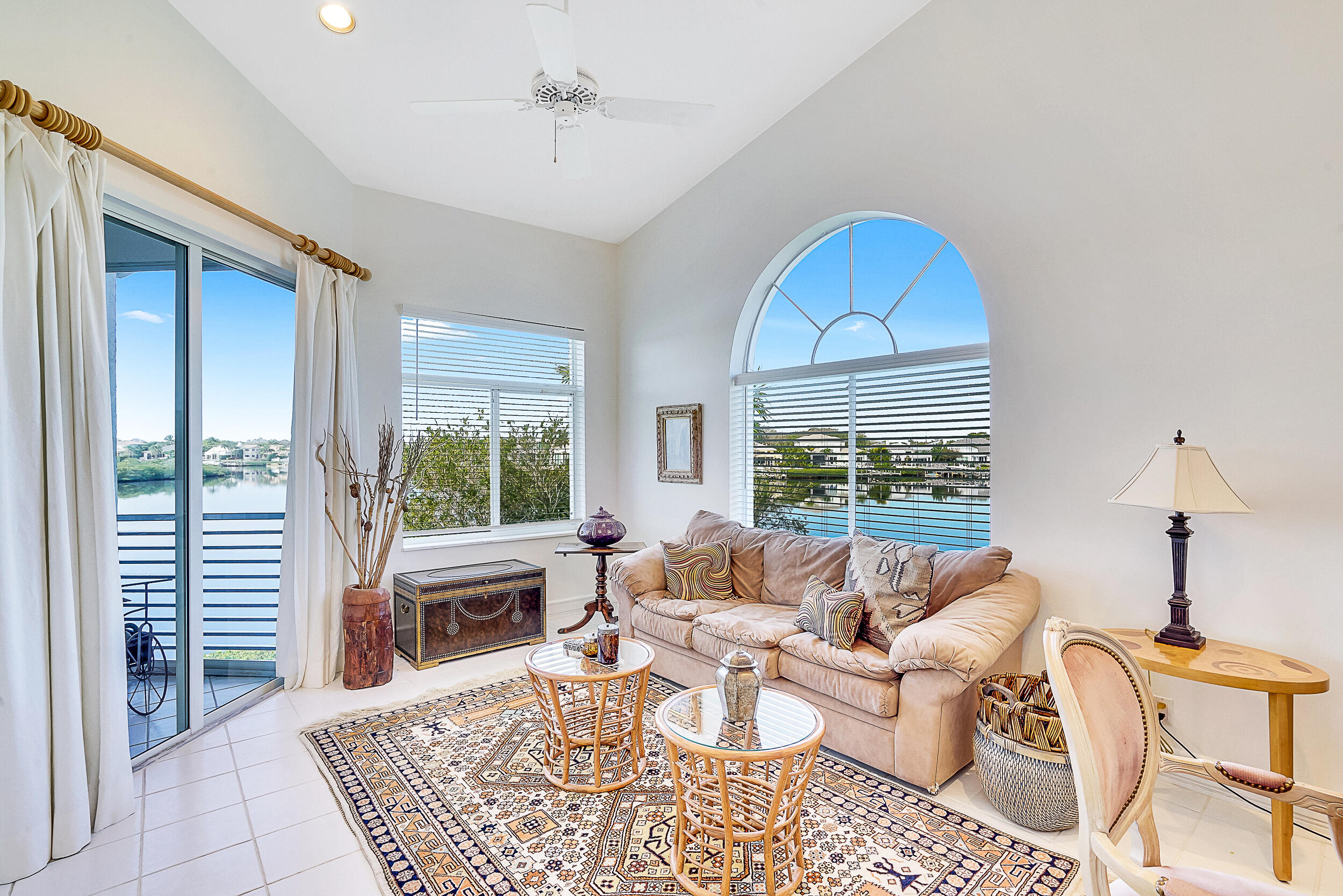 2703 Captains Way Jupiter, FL 33477 - Photo 6 of 57 a living room with furniture a window and a table