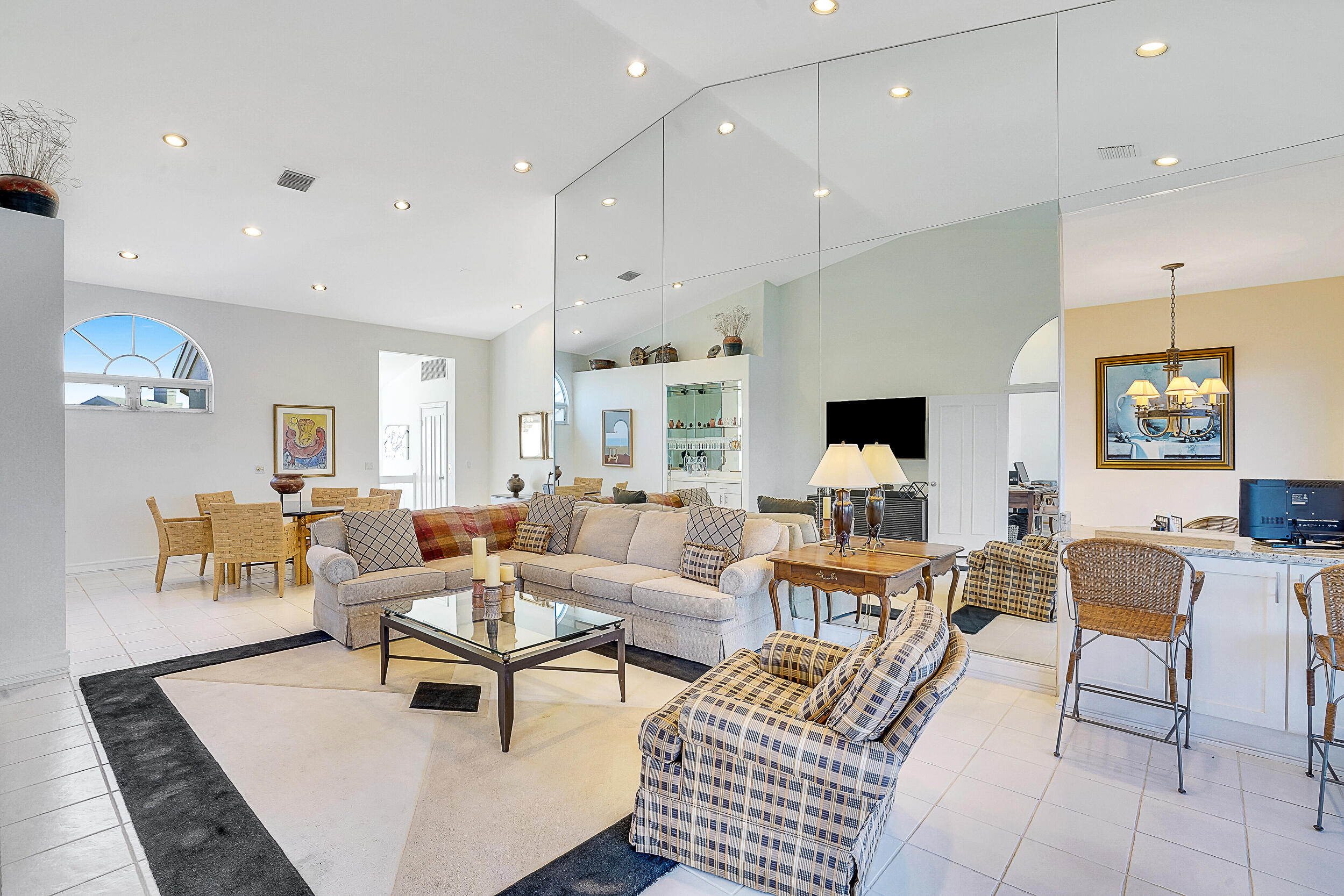 2703 Captains Way Jupiter, FL 33477 - Photo 10 of 57 a living room with furniture kitchen view and a chandelier