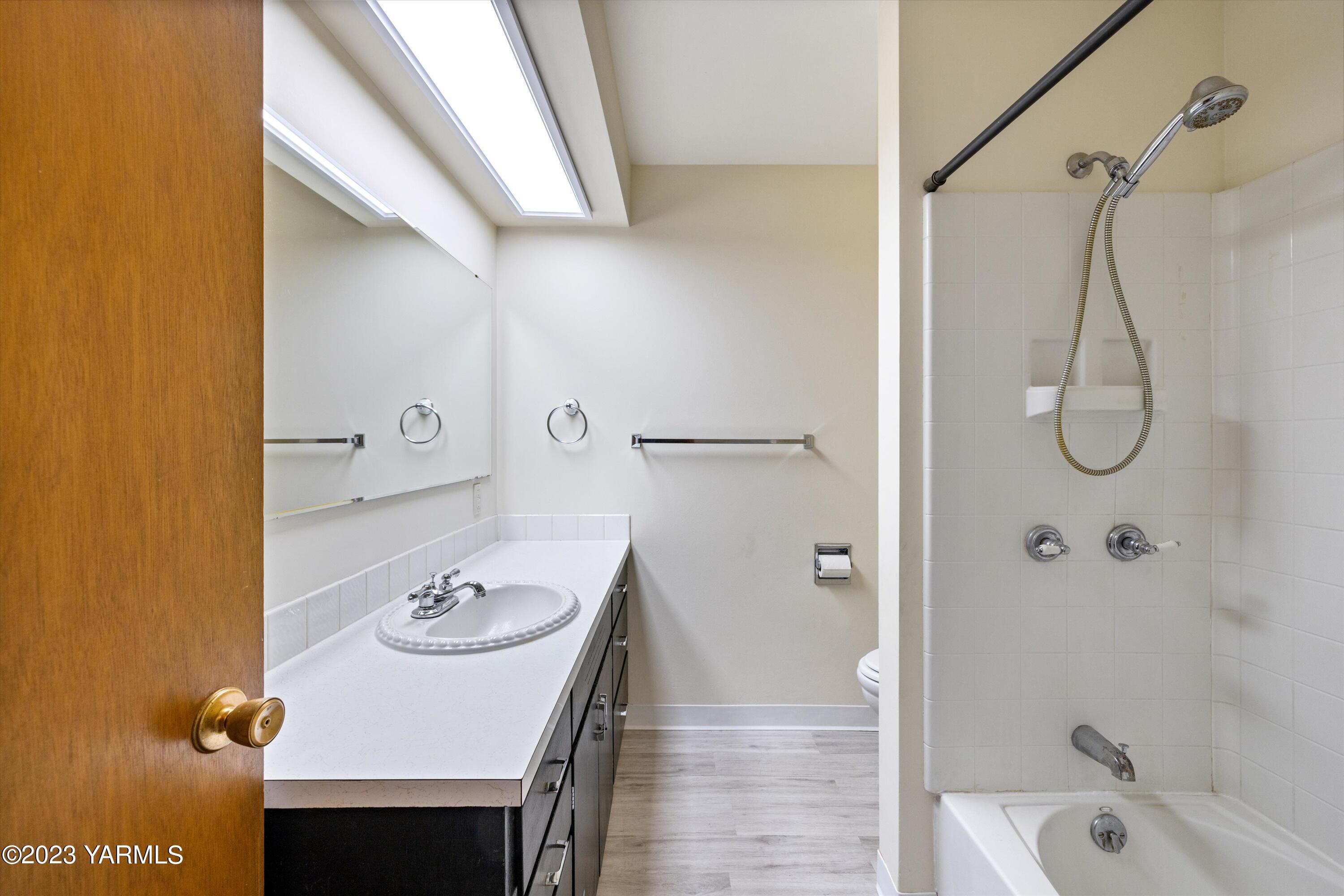 2901 Jones Road Wapato, WA 98951 - Photo 20 of 32 a bathroom with a sink vanity granite tub shower and a mirror