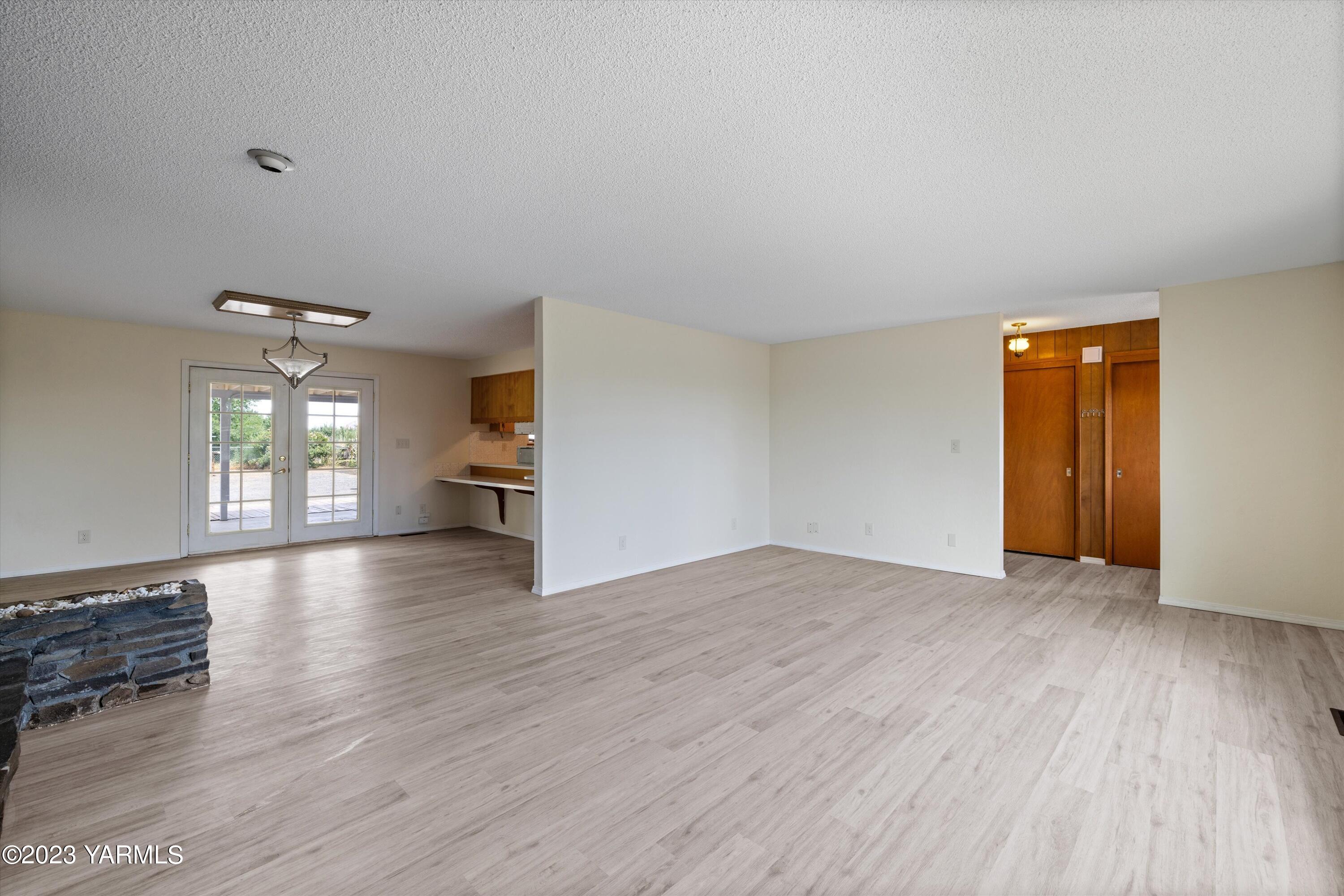2901 Jones Road Wapato, WA 98951 - Photo 8 of 32 wooden floor in an empty room with a window