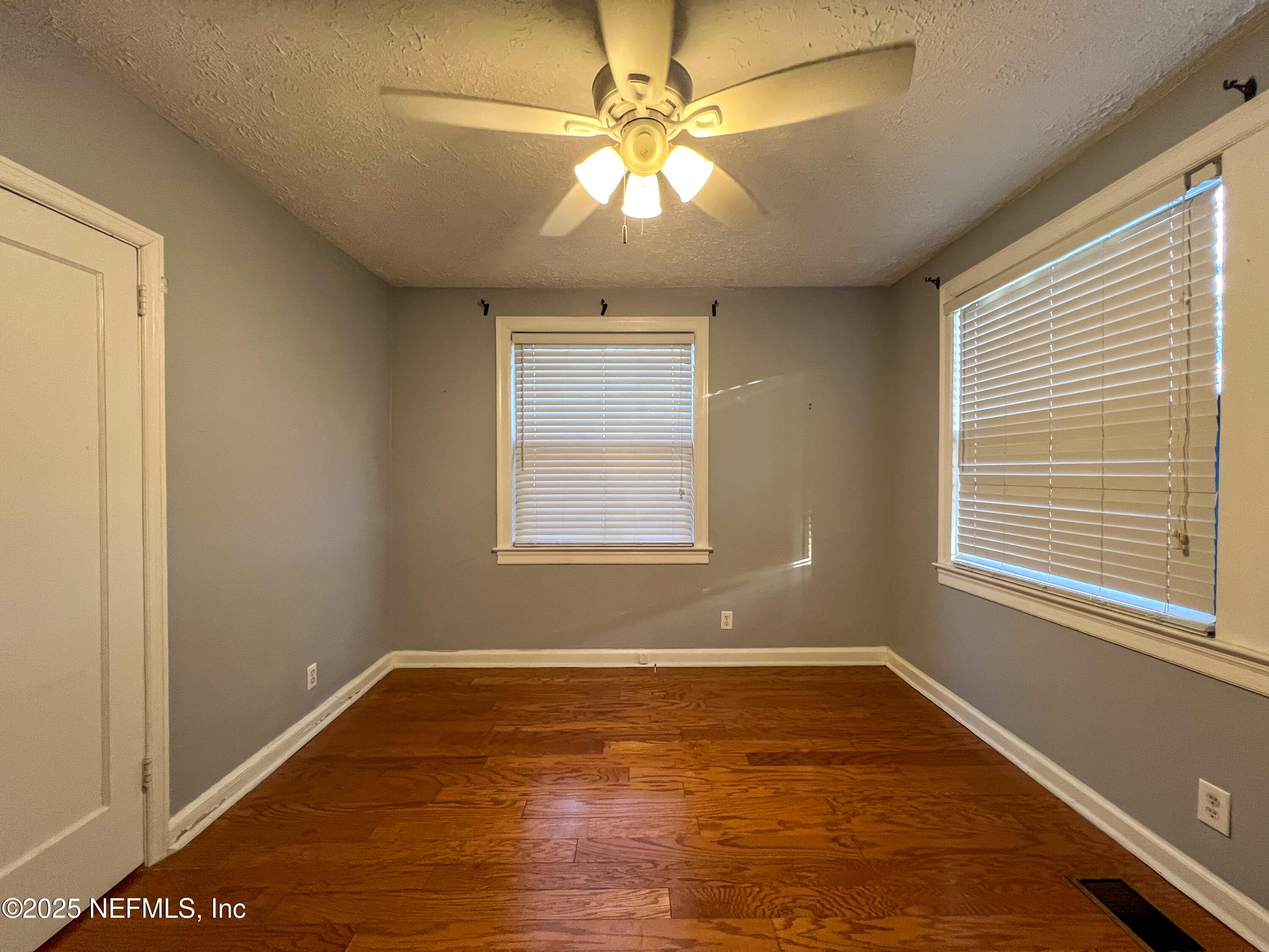 1733 River Road, Unit 1 Jacksonville, FL 32207 - Photo 13 of 16 a view of an empty room with window and wooden floor