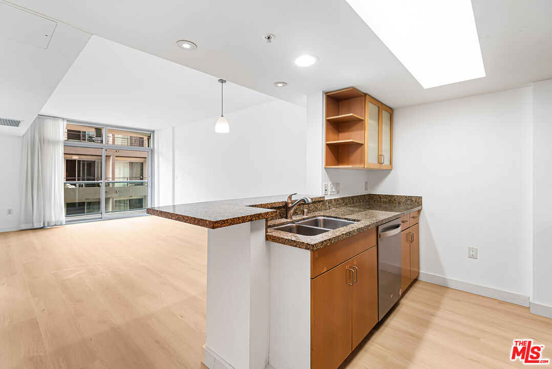 a kitchen with a stove and a refrigerator