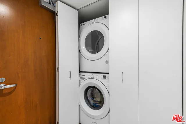 a bathroom with a tub shower and sink