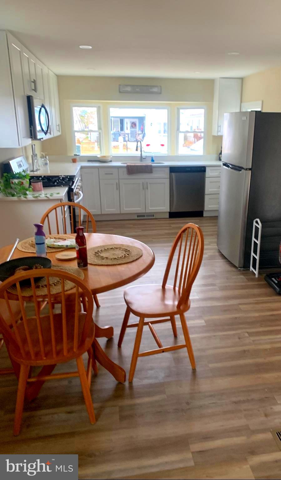119 Clamshell Road Ocean City, MD 21842 - Photo 2 of 14 a view of a dining room with furniture and window