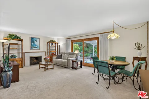 a view of a livingroom with furniture window and outside view