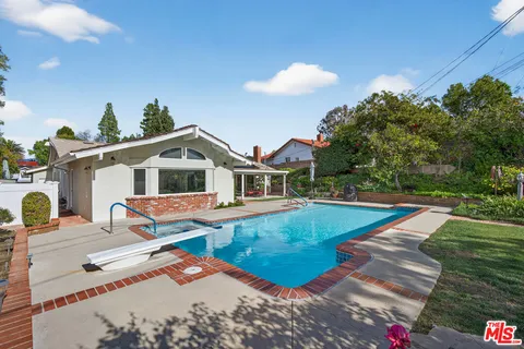a view of a house with swimming pool