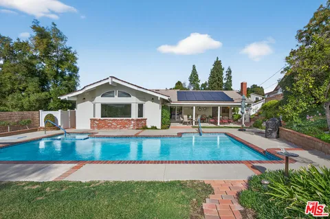 a view of a house with swimming pool