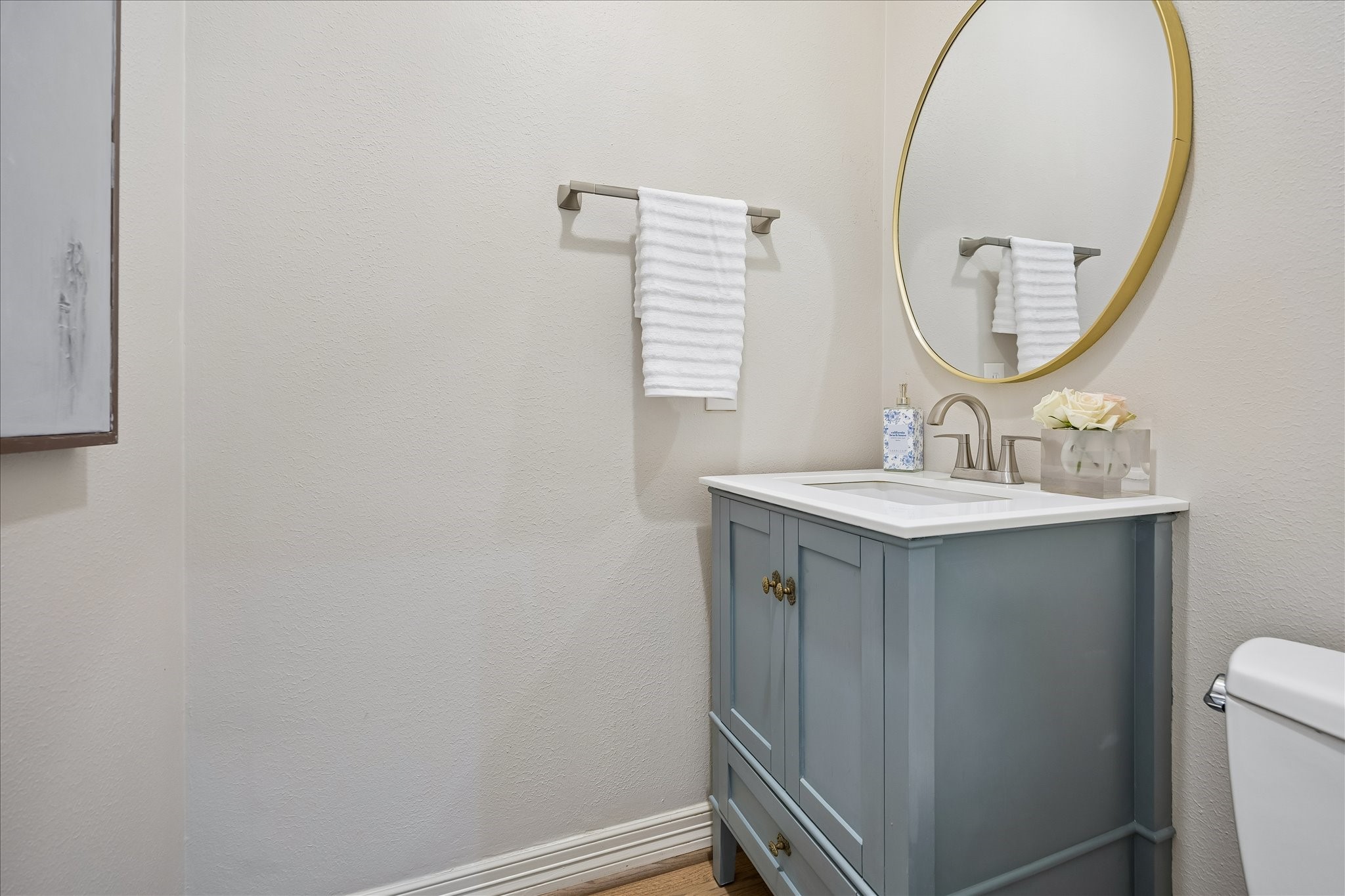 4131 Sunset Boulevard Houston, TX 77005 - Photo 25 of 38 a bathroom with a sink a mirror and a toilet