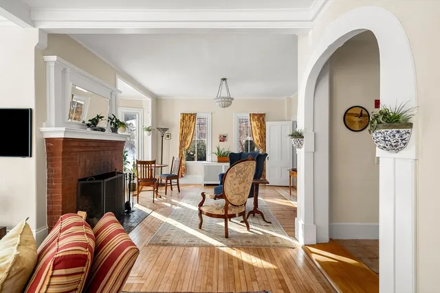 a living room with fireplace furniture and a flat screen tv