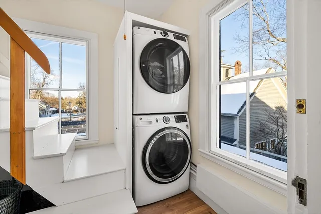a view of a hallway with washer and dryer