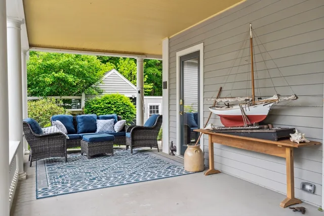 a outdoor living space with furniture and a rug
