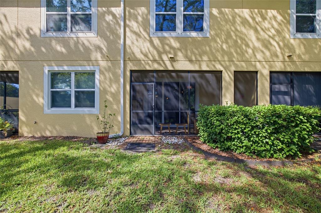 2013 Sunset Wind Loop Oldsmar, FL 34677 - Photo 30 of 43 a view of a house with potted plants and a yard