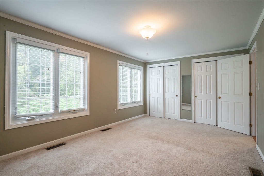 12 Perley Road, Unit 5 Derry, NH 03038 - Photo 11 of 21 a view of an empty room with a window
