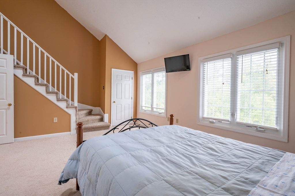 12 Perley Road, Unit 5 Derry, NH 03038 - Photo 14 of 21 a bedroom with a bed and a window