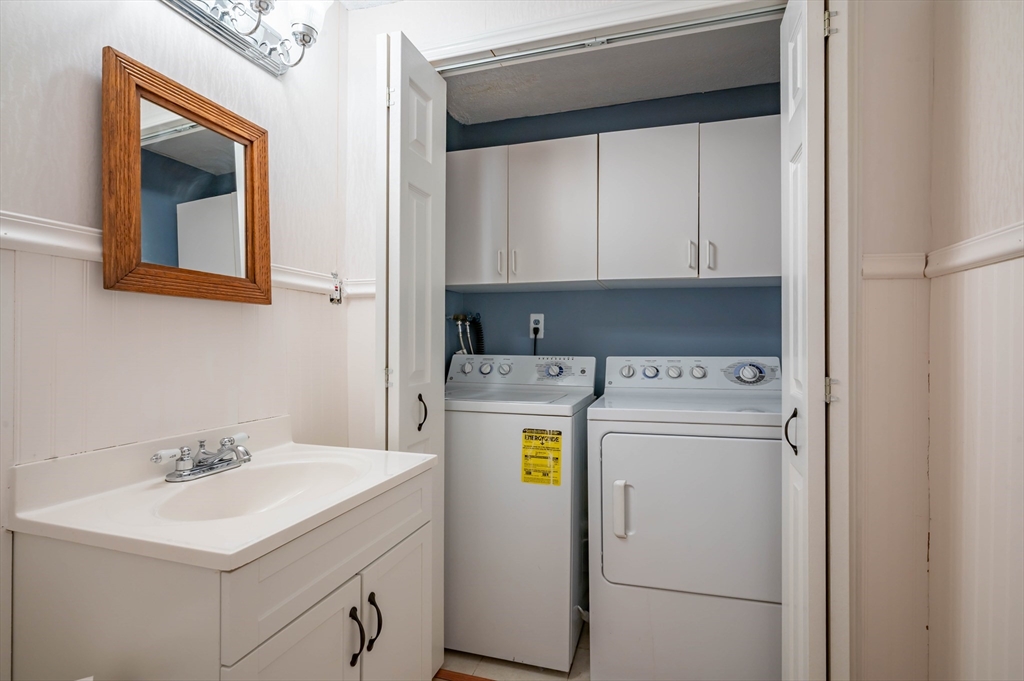 12 Perley Road, Unit 5 Derry, NH 03038 - Photo 8 of 21 a utility room with dryer and washer