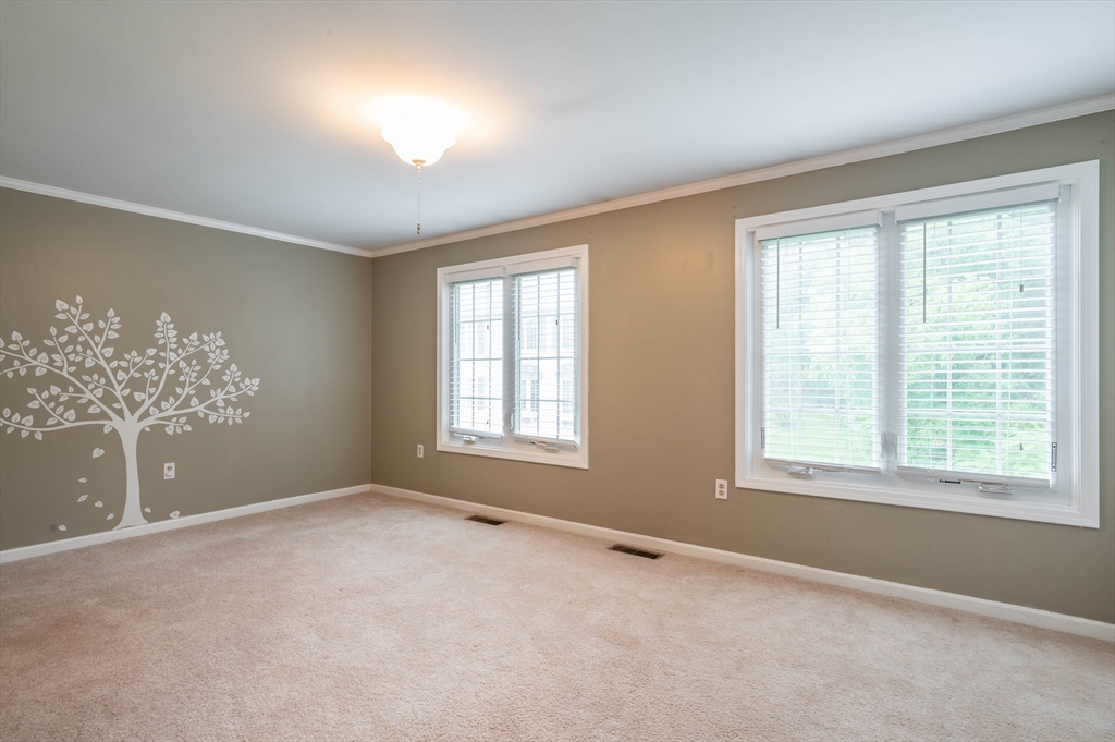 12 Perley Road, Unit 5 Derry, NH 03038 - Photo 9 of 21 a view of wooden floor and windows in a room
