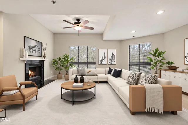 a living room with furniture and a fireplace