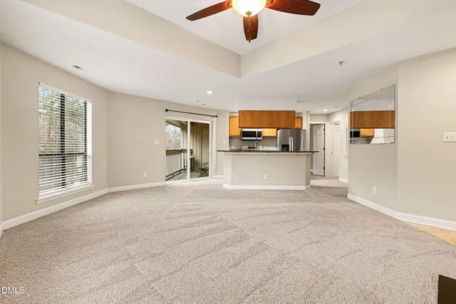 a view of a kitchen with a sink and microwave