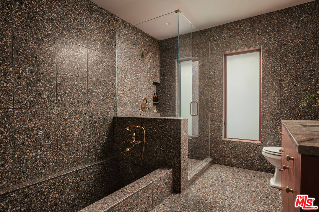 775 San Rafael Terrace Pasadena, CA 91105 - Photo 31 of 56 a bathroom with a toilet and a shower