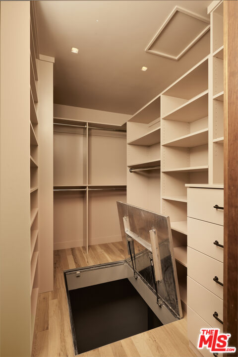 775 San Rafael Terrace Pasadena, CA 91105 - Photo 34 of 56 a view of walk in closet with empty racks