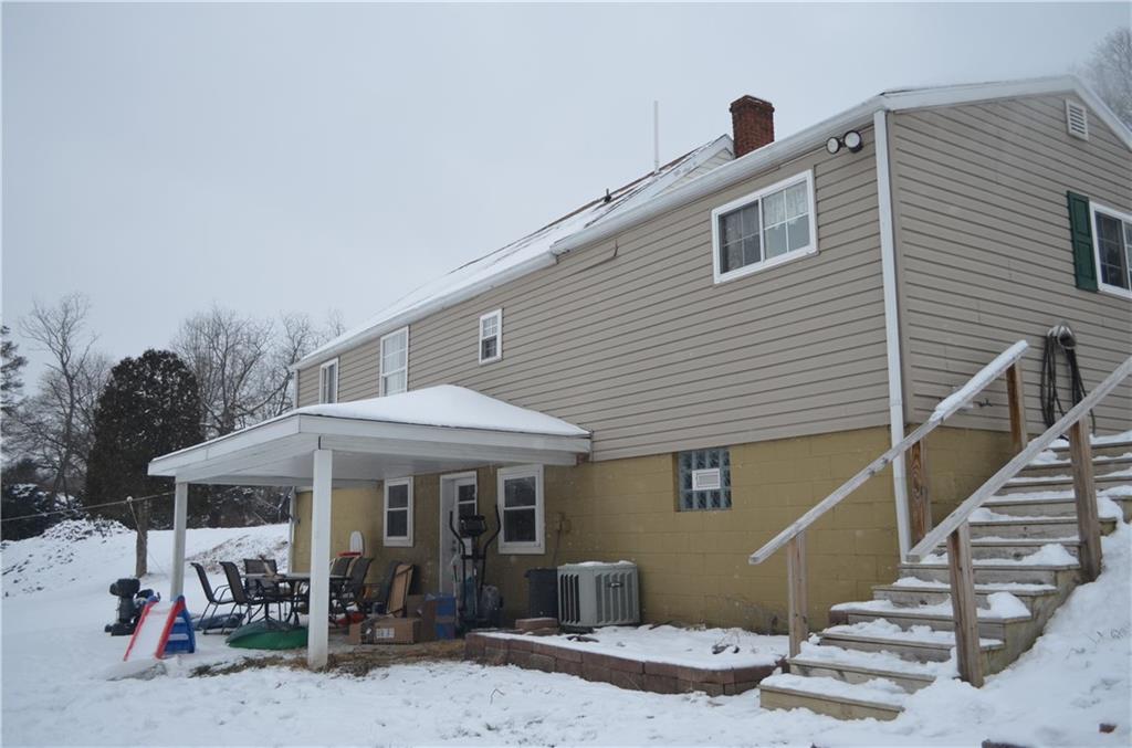 Wooden steps & railings are new -- nice view of the back covered porch area