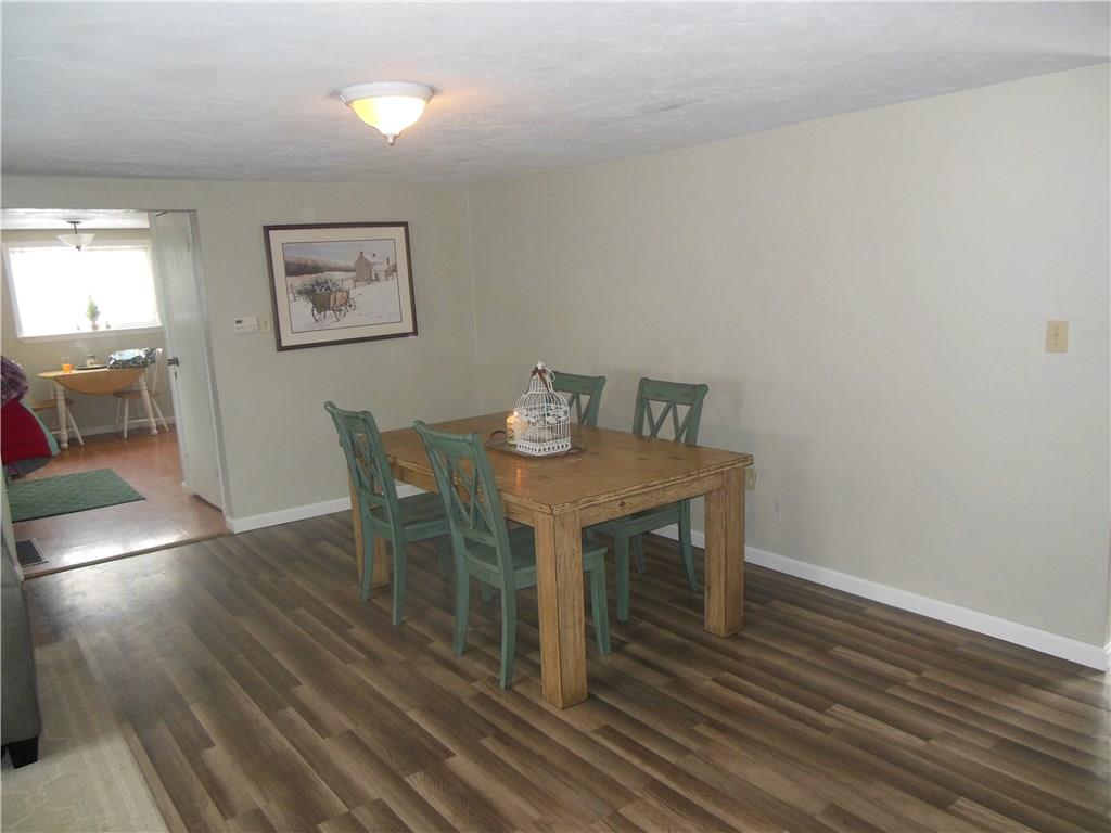 4145 Rte 908 Natrona Heights, PA 15065 - Photo 10 of 25 Dining area/living room combination -- brand new laminate flooring -- doorway leads to the kitchen