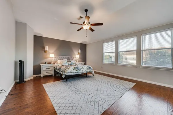 a bedroom with bed and window