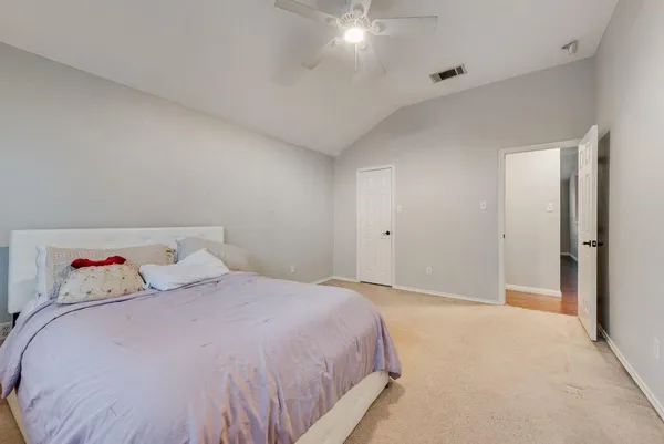 a bedroom with a bed and closet