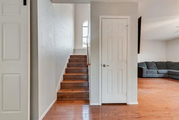 a view of a livingroom with stairs