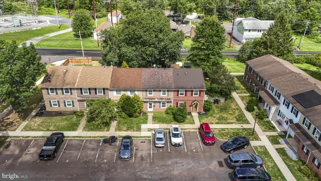 an aerial view of a house with swimming pool garden and outdoor seating