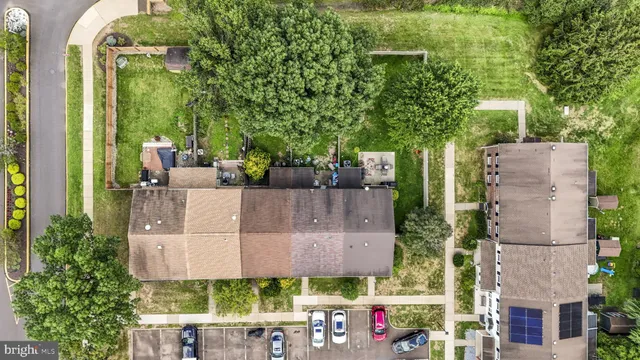 aerial view of a house with a yard and plants