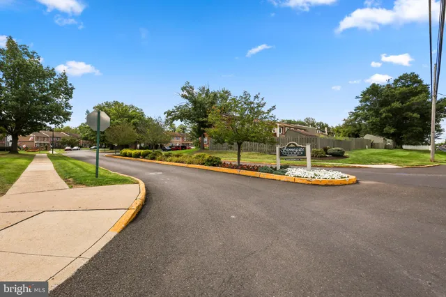 a view of a house with swimming pool and a yard