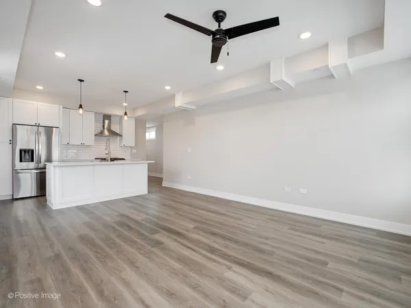 a view of kitchen with wooden floor