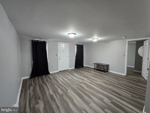 a view of a room with a flat screen tv