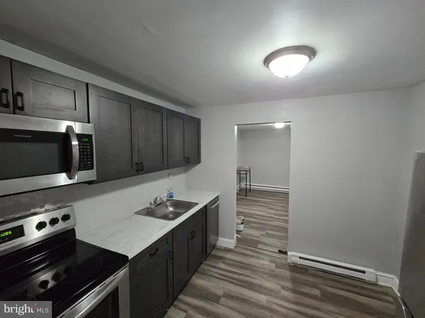 a kitchen with a stove and a microwave