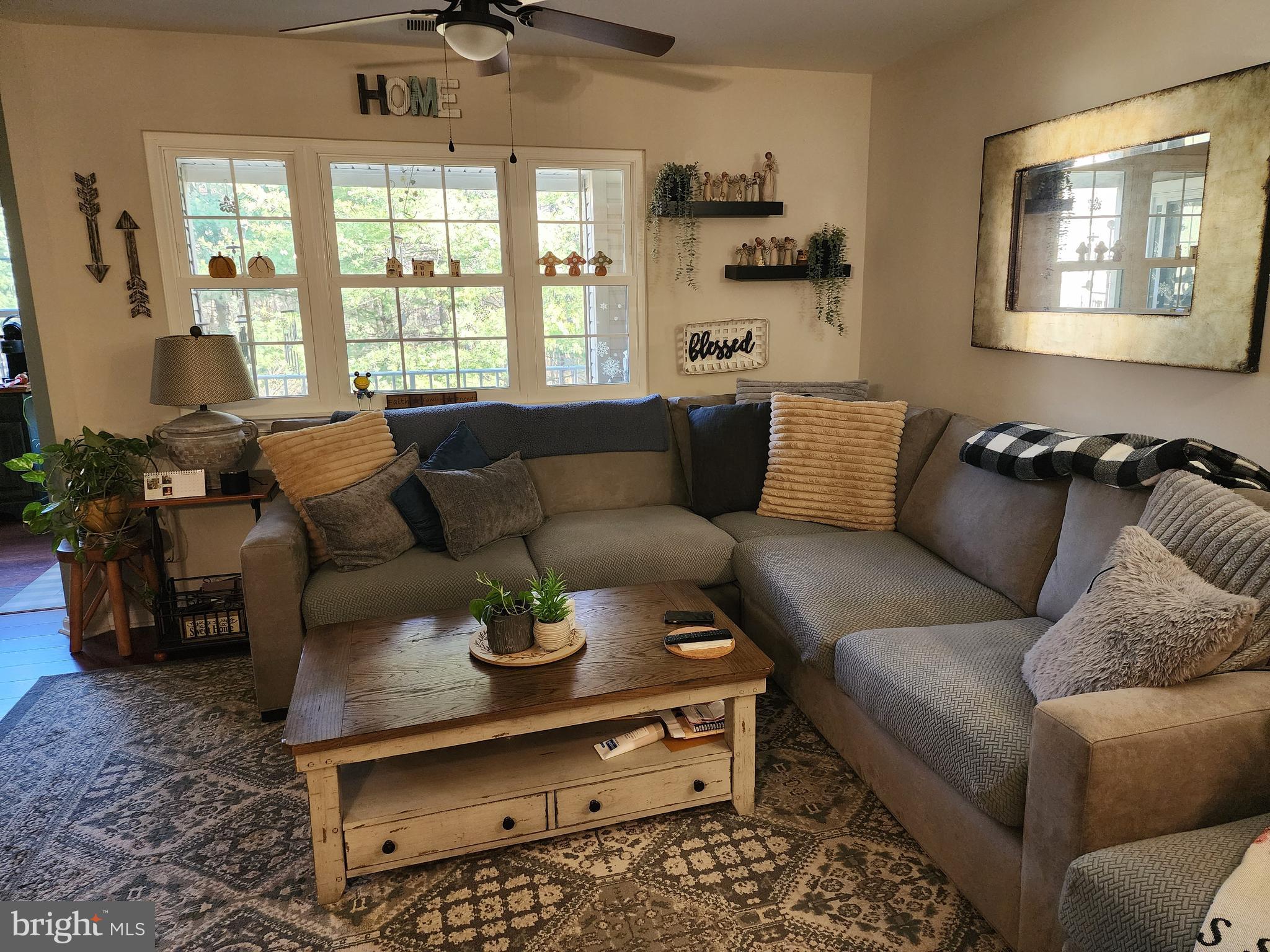 132 Mowat Circle Hamilton, NJ 08690 - Photo 2 of 16 a living room with furniture a rug and a window