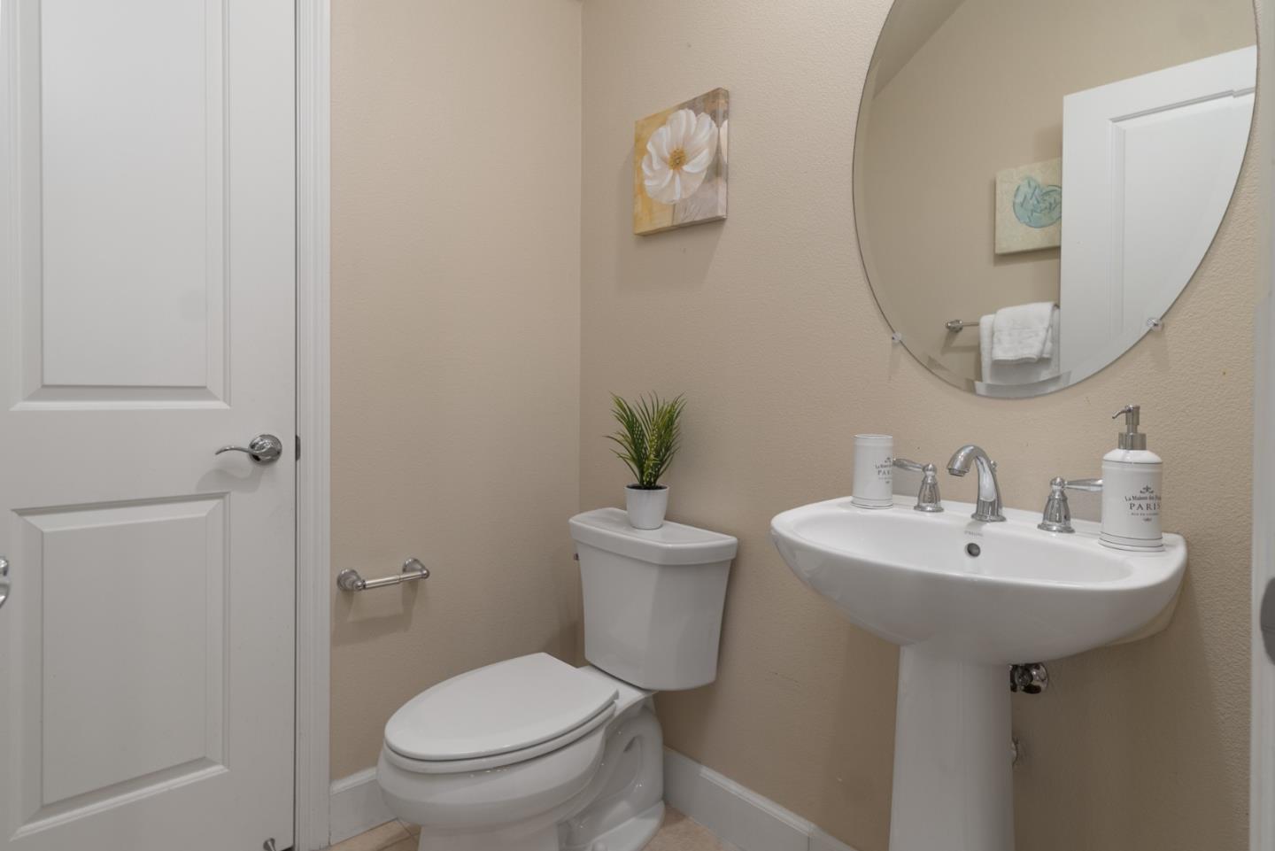 545 Holthouse Terrace Sunnyvale, CA 94087 - Photo 11 of 24 a bathroom with a sink toilet and a mirror