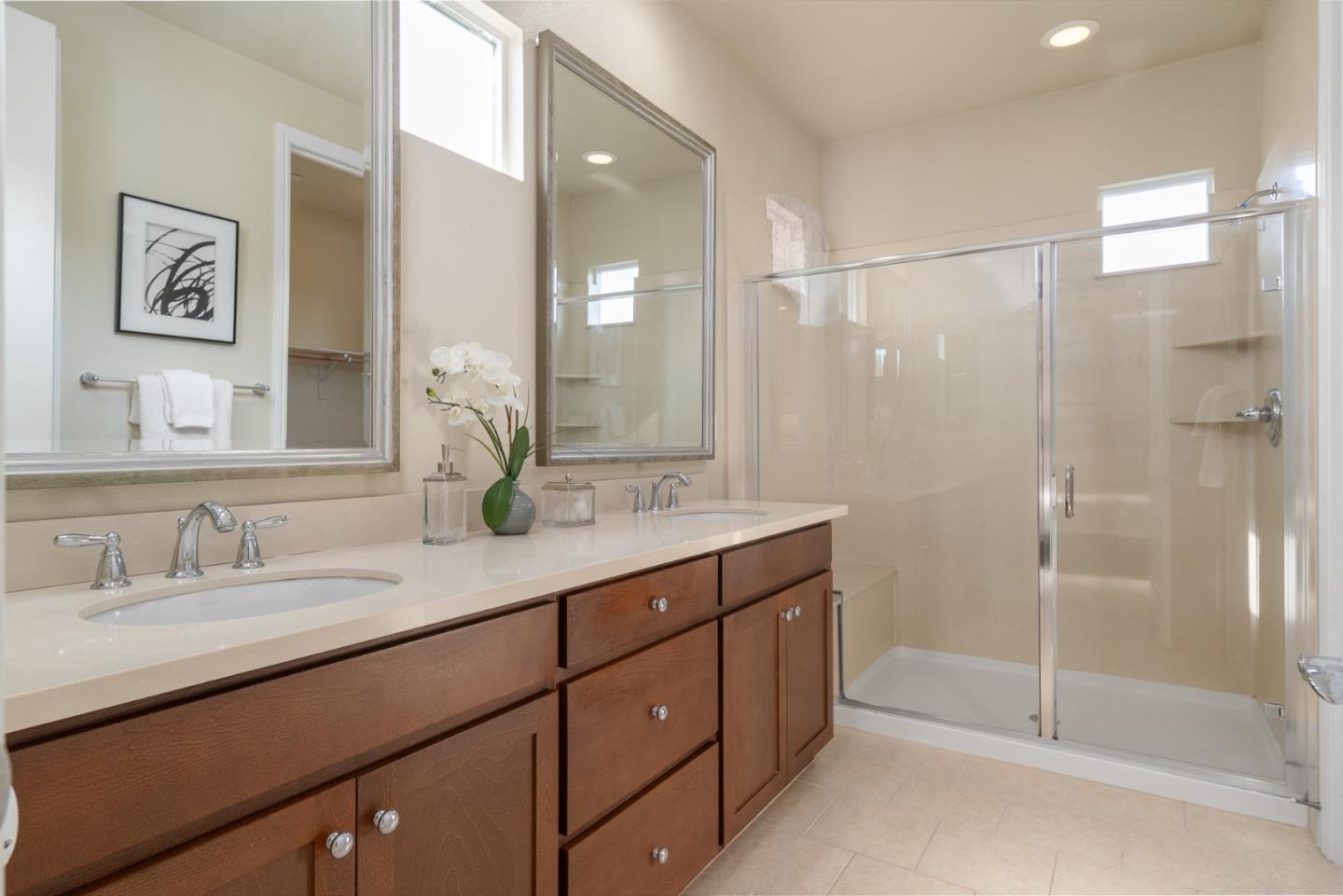 545 Holthouse Terrace Sunnyvale, CA 94087 - Photo 14 of 24 a bathroom with a double vanity sink mirror and shower
